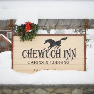Chewuch Inn roadside sign with snow